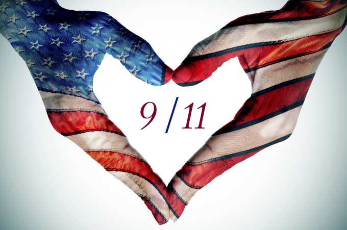 hands forming a heart patterned as the flag of the United States and text 9/11